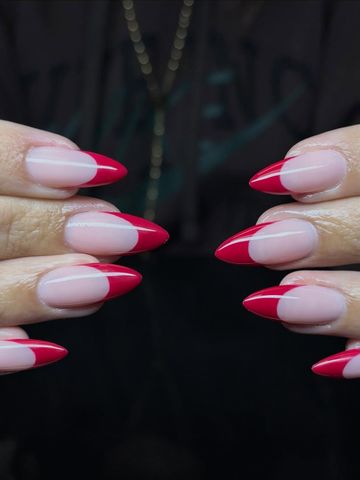 Can never go wrong with a red frenchie: Gel-X and French & Classic nails by Evil With Elegance, Miami