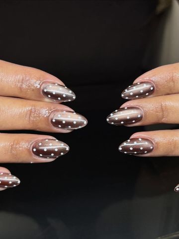 Polka dot cateye: Gel-X and Chrome & Cat-Eye nails by Evil With Elegance, Miami